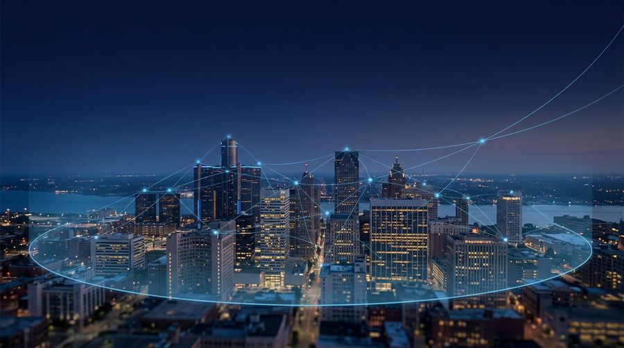 A Michigan business skyline at dusk connected by a glowing azure network, representing managed IT services linking and securing organizations across the region for stable growth